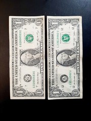 OPPOSITE MISCUT ERROR BILLS. LOT OF TWO $1 NOTES